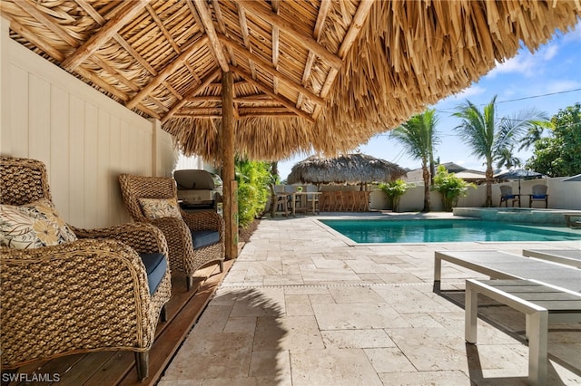 view of swimming pool featuring a gazebo and a patio area