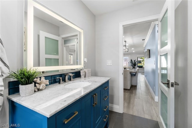 bathroom with hardwood / wood-style flooring and vanity