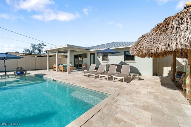 view of pool featuring an outdoor living space and a patio