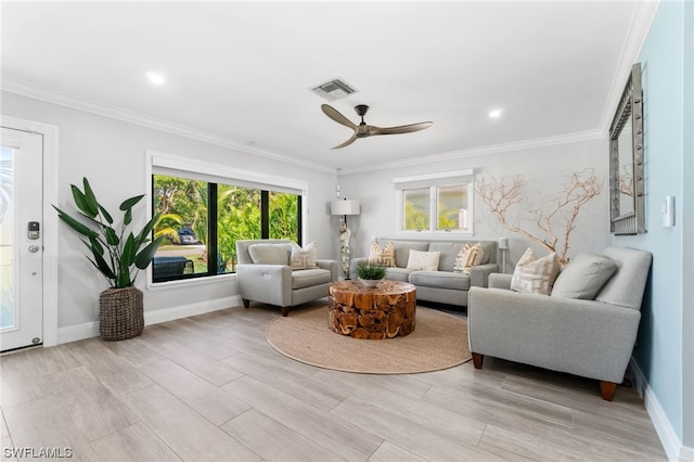 living room featuring crown molding and ceiling fan