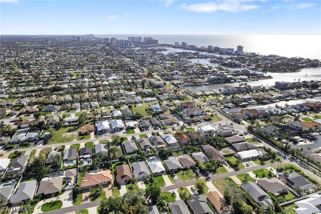 drone / aerial view with a water view