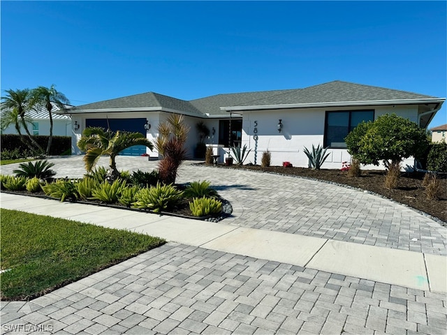 ranch-style house featuring a garage