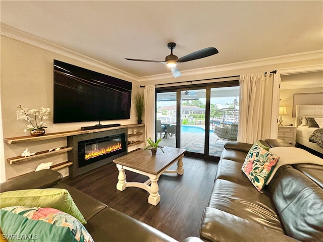 living room featuring dark hardwood / wood-style flooring, crown molding, and ceiling fan