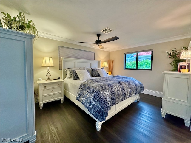 bedroom with crown molding, ceiling fan, and dark hardwood / wood-style flooring