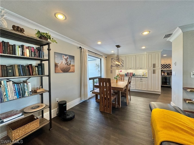 dining room with dark hardwood / wood-style floors and ornamental molding