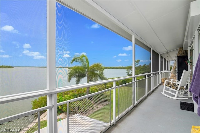 sunroom with a water view and plenty of natural light