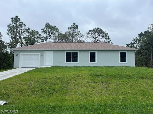 ranch-style house featuring a garage and a front yard