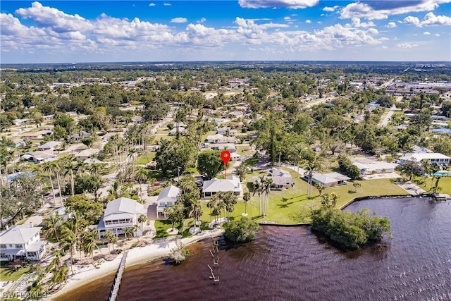 drone / aerial view with a water view and a residential view