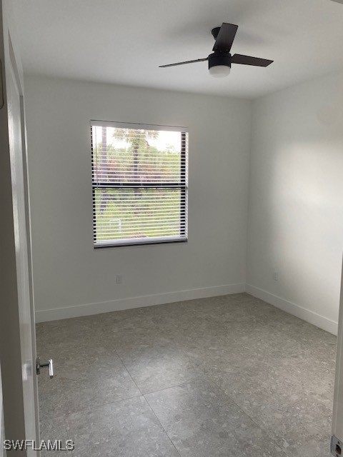 empty room featuring ceiling fan