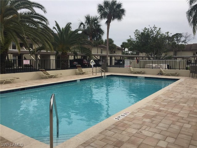 view of swimming pool featuring a patio area