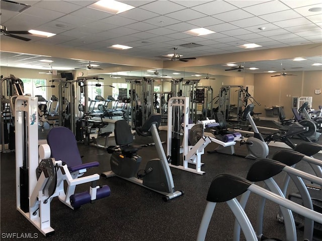 exercise room featuring a drop ceiling