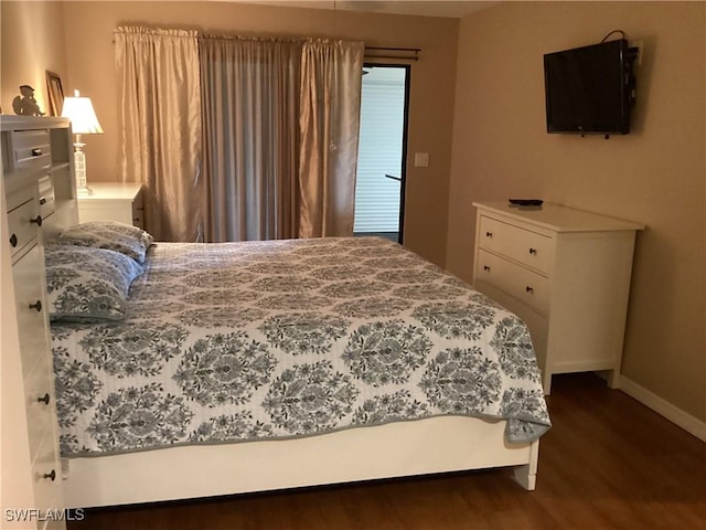 bedroom featuring dark wood-type flooring