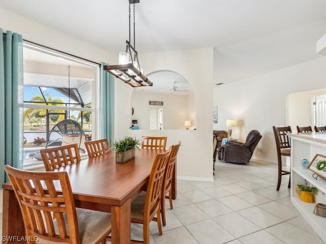 dining room featuring light tile patterned floors and ceiling fan