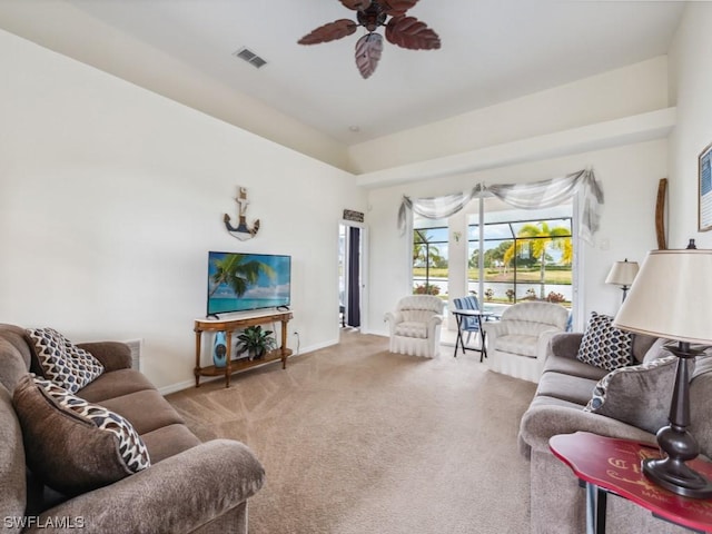 living room featuring carpet floors and ceiling fan