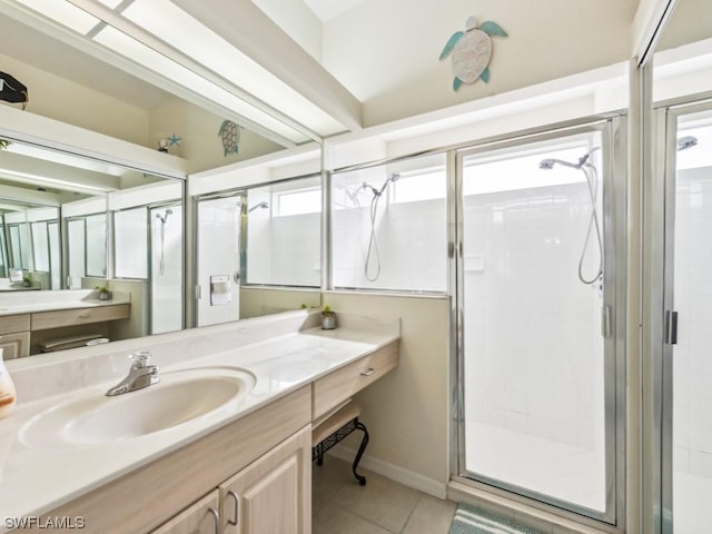 bathroom featuring tile patterned flooring, vanity, and an enclosed shower