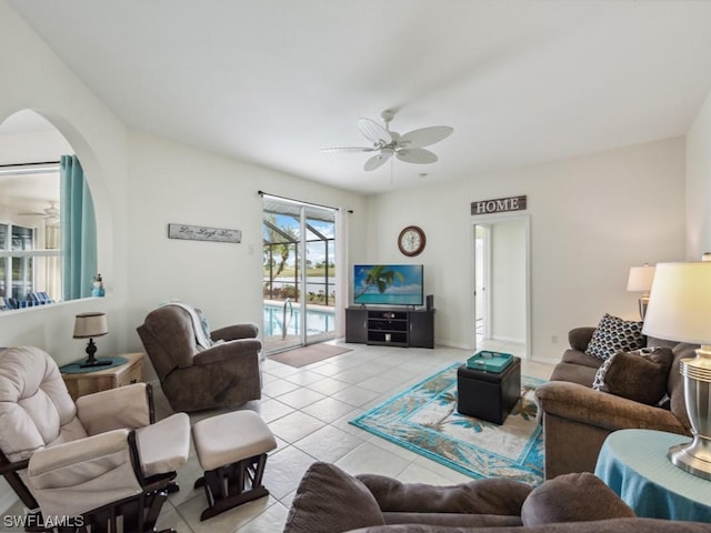 tiled living room with ceiling fan