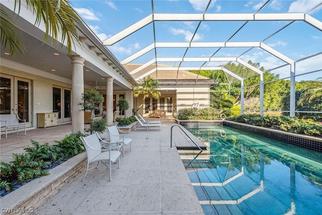 outdoor pool featuring a patio and a lanai