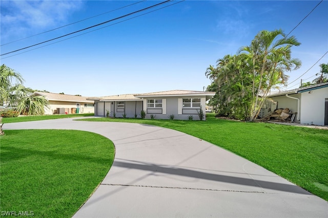 ranch-style home with a front yard and a garage