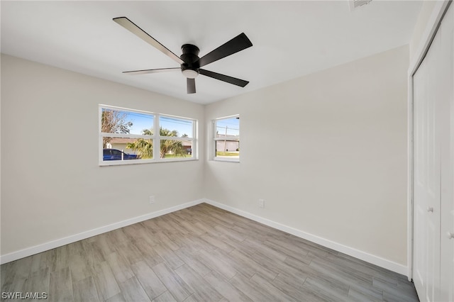 empty room featuring light hardwood / wood-style floors and ceiling fan