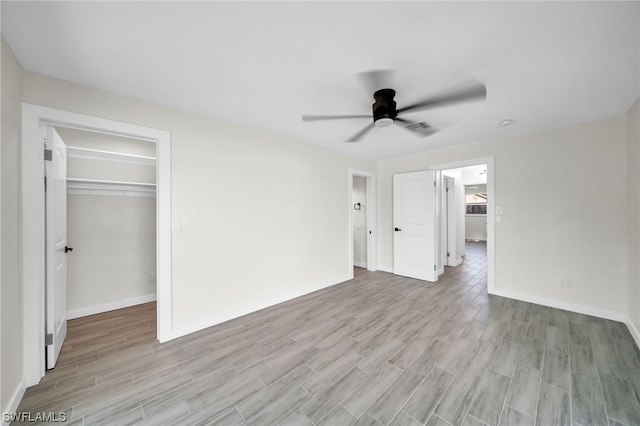 unfurnished room featuring ceiling fan and light hardwood / wood-style flooring