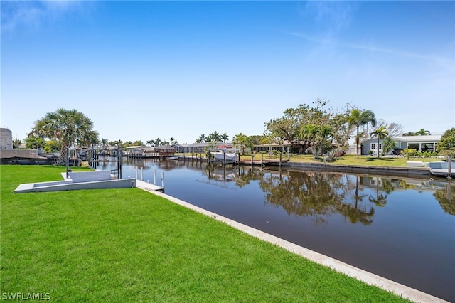 dock area featuring a water view and a lawn