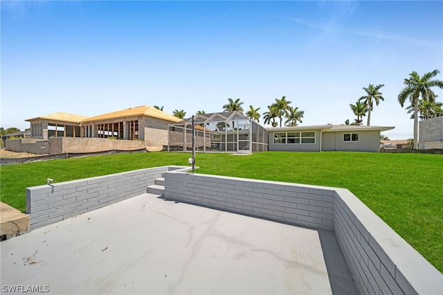 view of terrace featuring glass enclosure