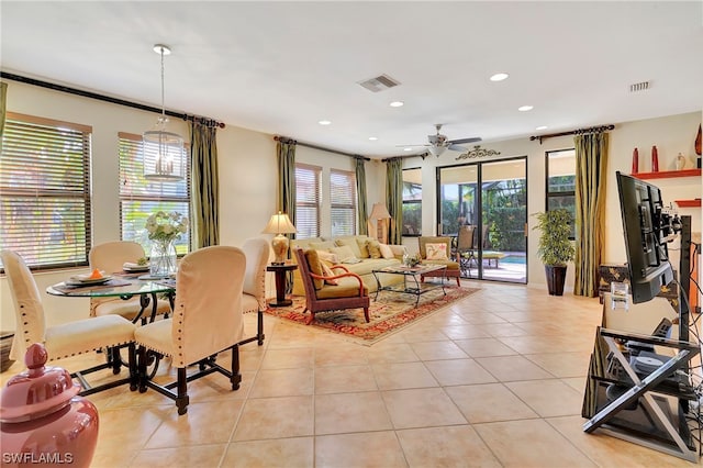 living room featuring light tile patterned floors and ceiling fan