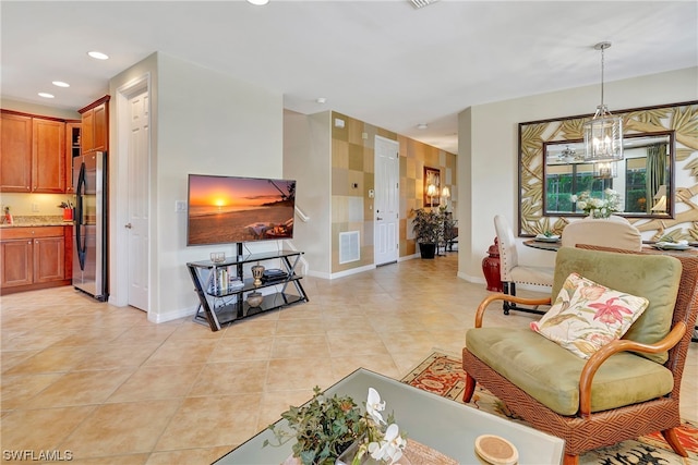 living room featuring light tile patterned floors and a notable chandelier