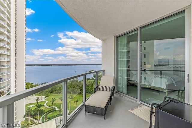 balcony featuring a water view