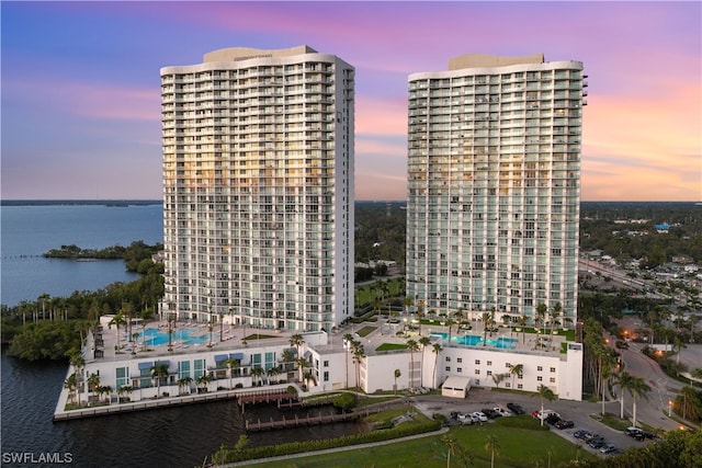 outdoor building at dusk featuring a water view