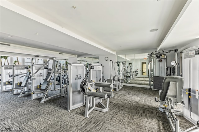 workout area featuring dark colored carpet