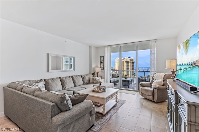 living room featuring light tile patterned floors and floor to ceiling windows