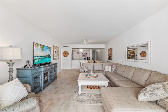 living room featuring vaulted ceiling