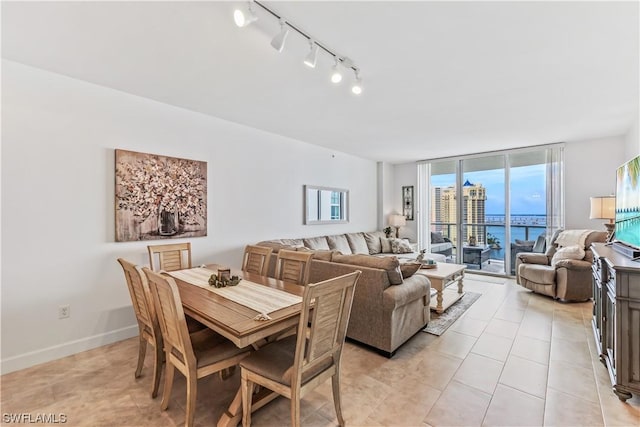 3000 Oasis Grand Blvd Unit 1507, Fort Myers, FL 33916 - dining area featuring rail lighting and light tile patterned floors