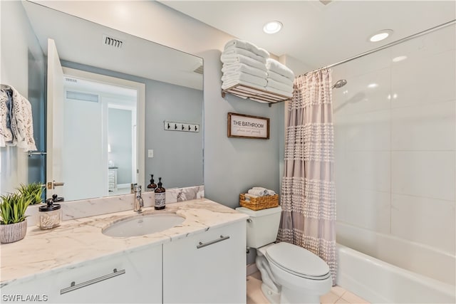 full bathroom with vanity, toilet, and shower / bath combo with shower curtain