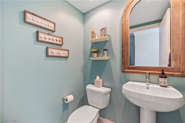 bathroom with sink and toilet