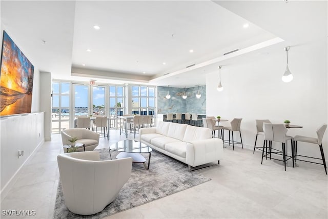 3000 Oasis Grand Blvd Unit 1507, Fort Myers, FL 33916 - living room featuring baseboards, recessed lighting, a raised ceiling, and visible vents
