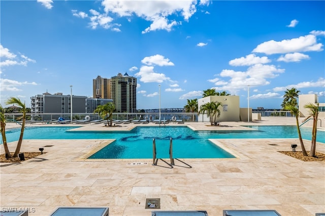 view of swimming pool featuring a patio area