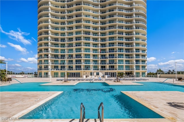 view of swimming pool featuring a patio area