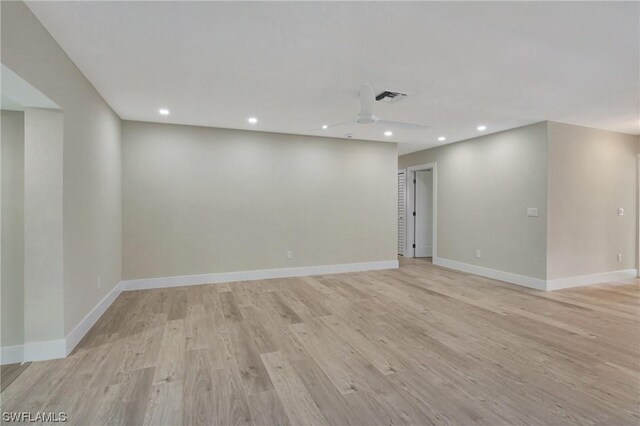 spare room with ceiling fan and light hardwood / wood-style flooring