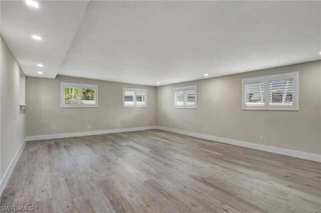 basement featuring light hardwood / wood-style floors