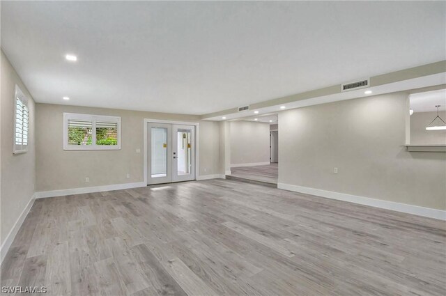 interior space featuring light hardwood / wood-style flooring and french doors