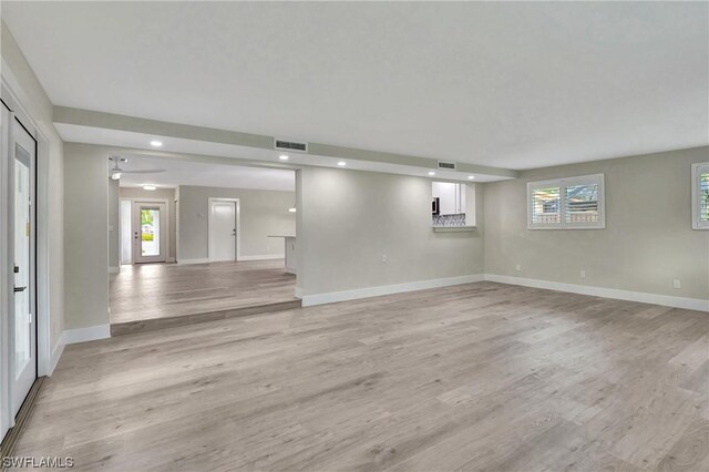 unfurnished living room featuring light wood-type flooring