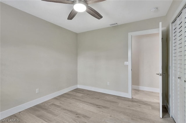 unfurnished room featuring ceiling fan and light hardwood / wood-style floors