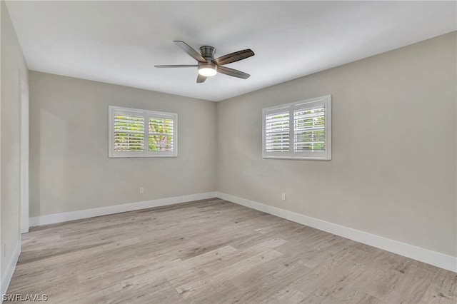 spare room featuring ceiling fan and light hardwood / wood-style floors