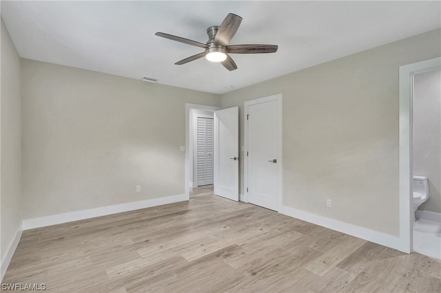 spare room featuring light hardwood / wood-style floors and ceiling fan