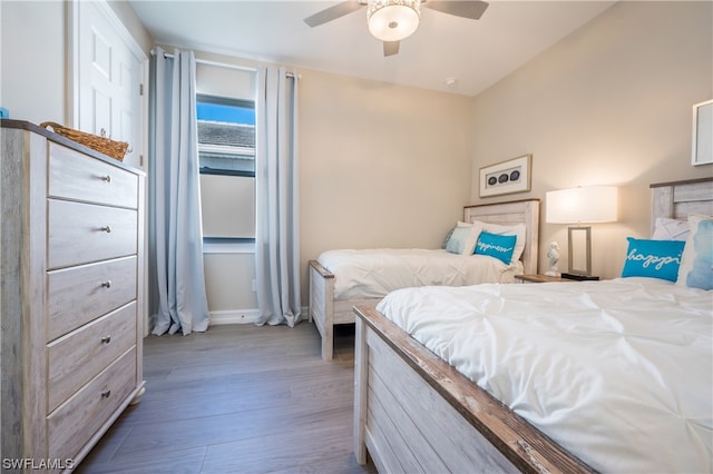 bedroom featuring ceiling fan and wood-type flooring