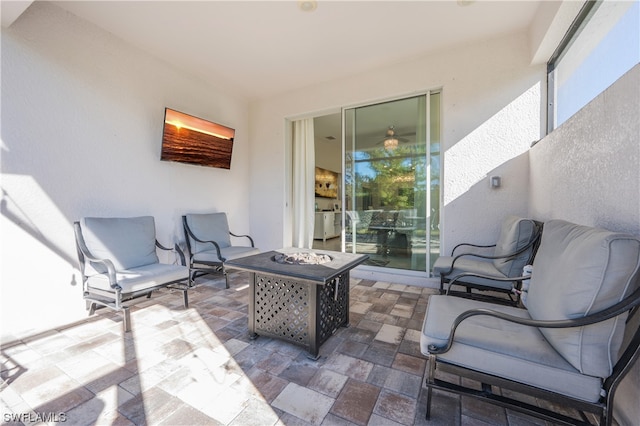 view of patio / terrace with an outdoor fire pit