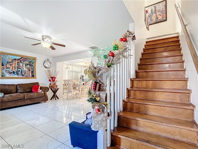 stairway with ceiling fan