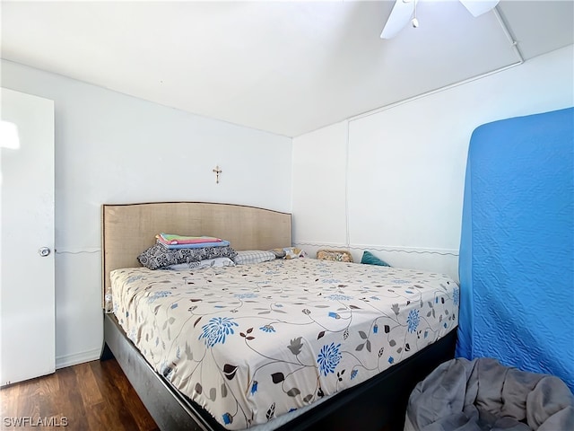 bedroom featuring ceiling fan and dark hardwood / wood-style floors